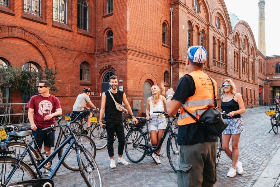 Berlin: Cold War & Berlin Wall History Guided Bike Tour - Cold War symbols: Checkpoint Charlie and the watchtower