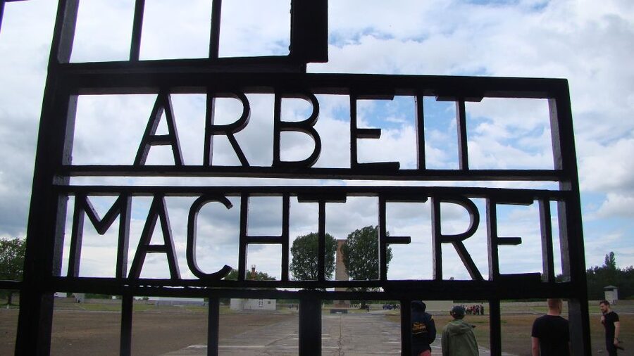 From Berlin: Sachsenhausen Concentration Camp Day Trip - Entering Sachsenhausen through the main gate with a guide